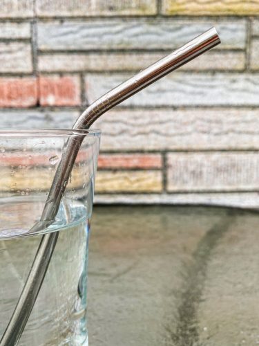 Reusable straw in a glass of water